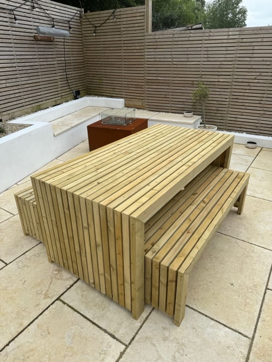 A handbuilt timber structure in a garden