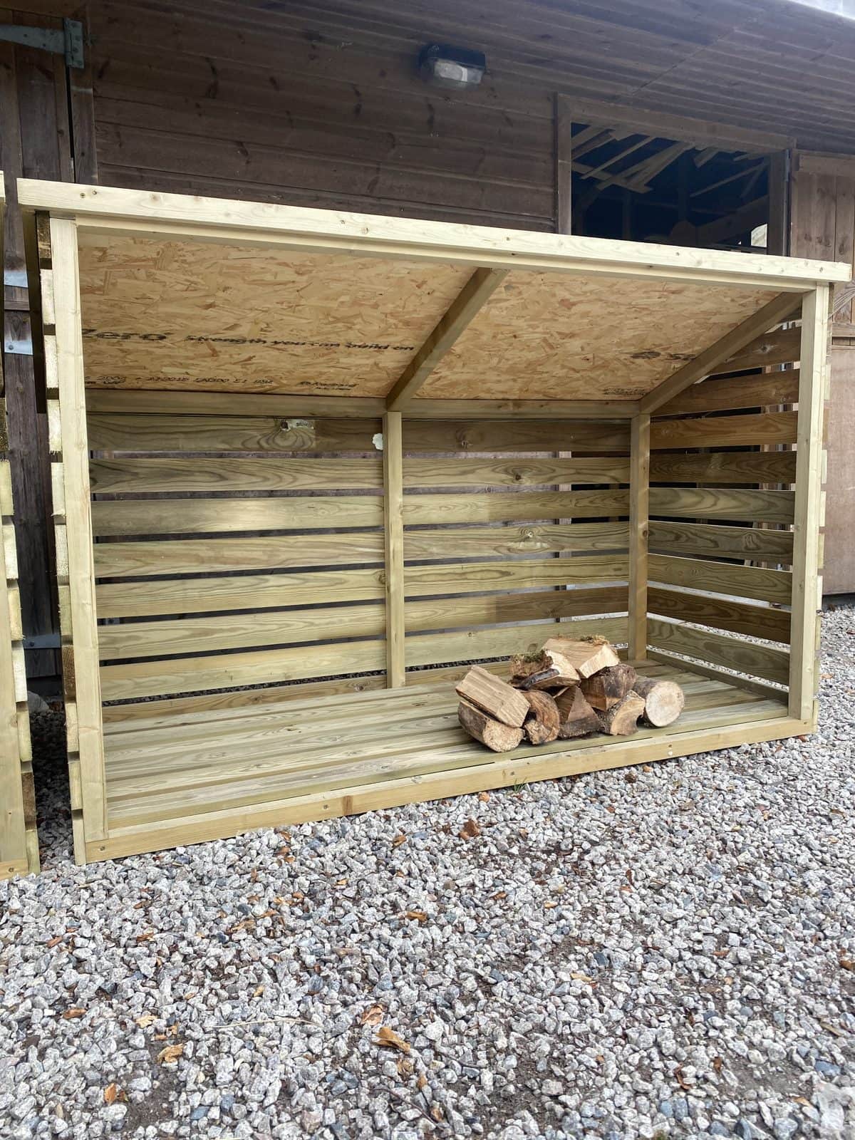 A large slatted timber log store