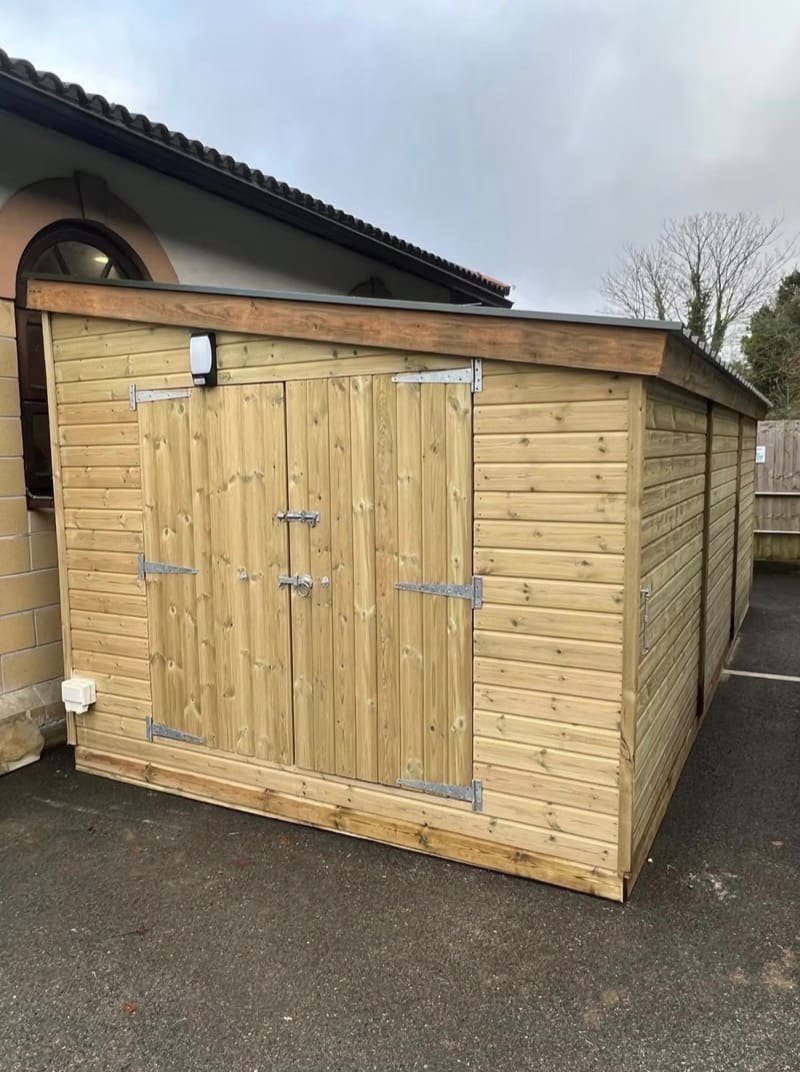 A garden storage shed with a single door