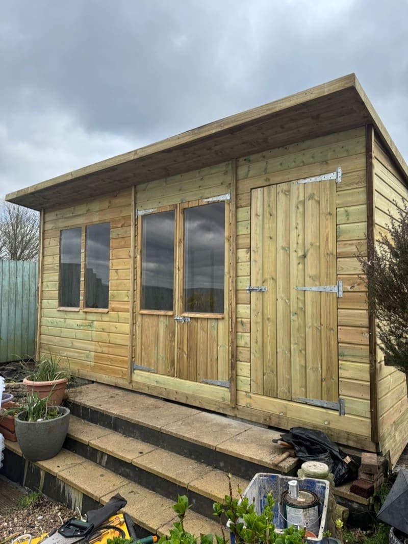 A bespoke shed with windows along one side